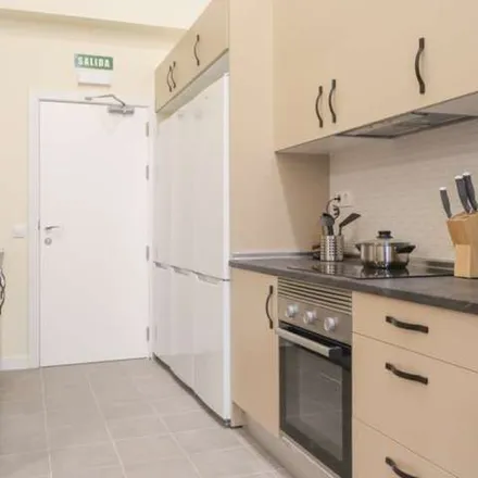 Rent this 8 bed apartment on Parroquia Nuestra Señora del Encuentro in Calle de Pedro Barreda, 28039 Madrid