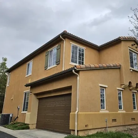 Rent this 4 bed house on 27292 Baviera Way in CA 91381, USA