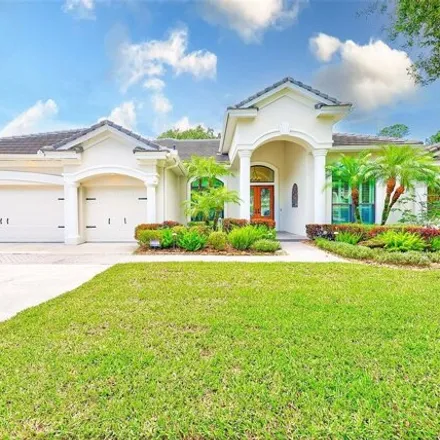 Buy this 4 bed house on 9915 Tree Tops Lake Road in Westchase, Hillsborough County