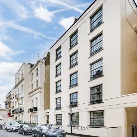 Rent this 4 bed apartment on Belgravia House in Halkin Place, London