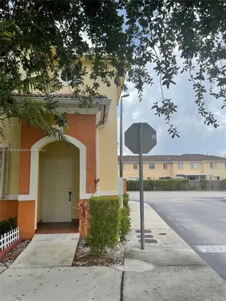 Buy this 3 bed townhouse on 7230 Northwest 174th Terrace in Miami-Dade County, FL 33015