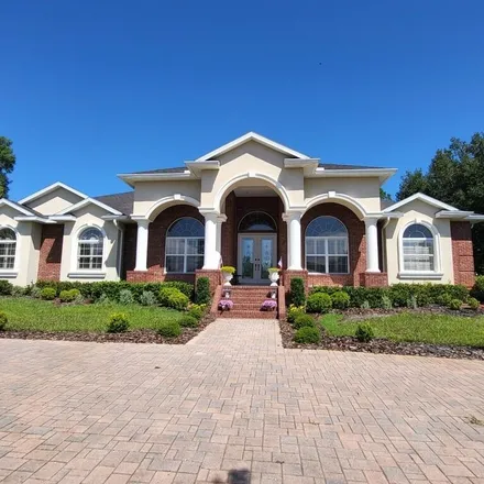 Buy this 4 bed house on 7263 Sylvan Glade Court in Spring Hill, FL 34607