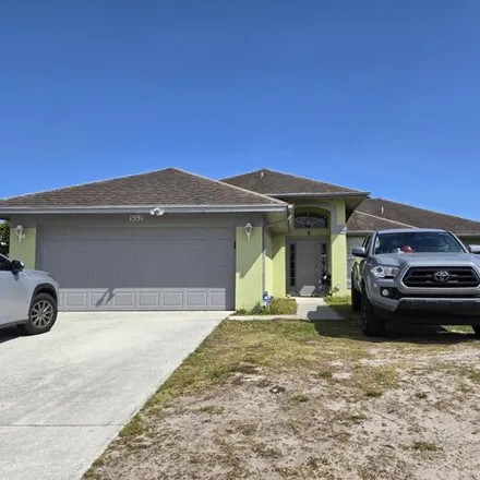 Buy this 3 bed house on 106 Southeast Carter Avenue in Port Saint Lucie, FL 34983