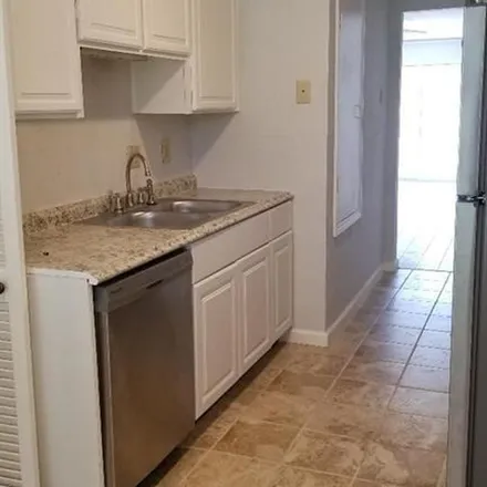 Rent this 2 bed townhouse on Ariel Street in Houston, TX 77074