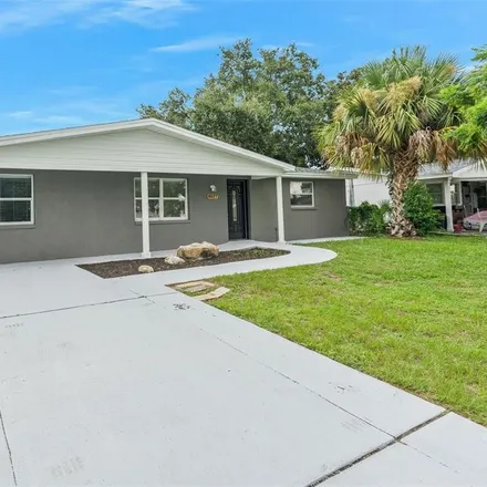Buy this 4 bed house on 4627 Tropical Lane in Holiday, FL 34690