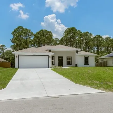 Buy this 4 bed house on 1546 Rainsville Road Southeast in Palm Bay, FL 32909