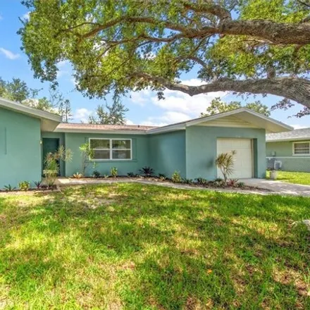 Rent this 3 bed house on 2702 SE 17th Ave in Cape Coral, Florida