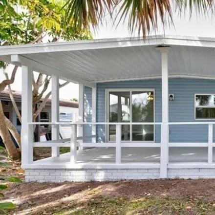 Buy this studio apartment on 882 Hawthorn Cir in Barefoot Bay, Florida