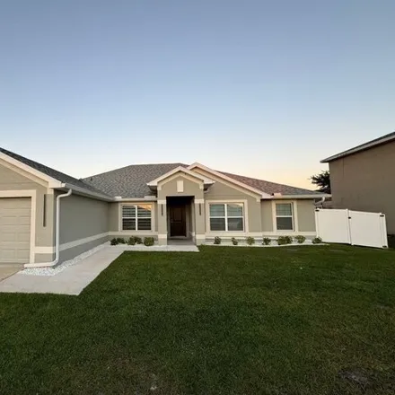 Rent this 4 bed house on 1191 Northeast 4th Place in Cape Coral, FL 33909