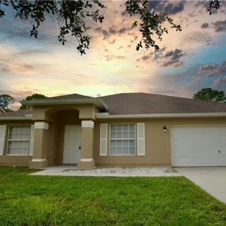 Rent this 3 bed house on 8215 105th Avenue in Vero Lake Estates, Indian River County