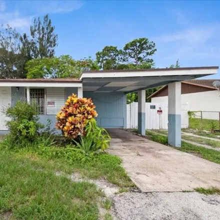 Buy this 4 bed house on 4740 10th Ave N in Lake Worth, Florida