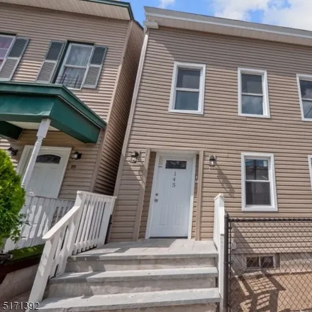 Buy this 6 bed townhouse on 139 16th Avenue in Paterson, NJ 07501