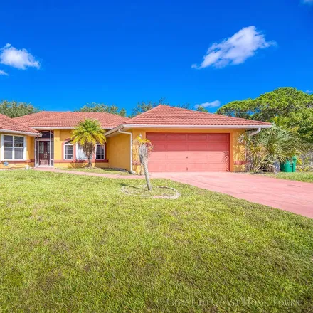 Buy this 3 bed house on 2701 Southeast Geneva Avenue in Port Saint Lucie, FL 34952