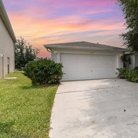 Buy this 3 bed house on 1617 Sawgrass Dr Sw in Palm Bay, Florida