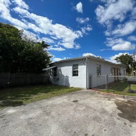 Rent this 2 bed house on Phippen-Waiters Road in Dania Beach, FL 33004