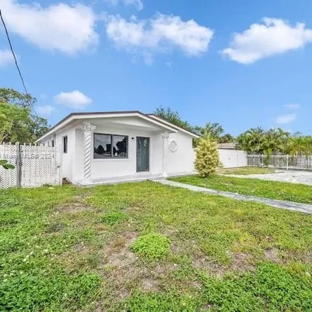 Buy this 6 bed house on 3051 Northwest 102nd Street in Miami-Dade County, FL 33147
