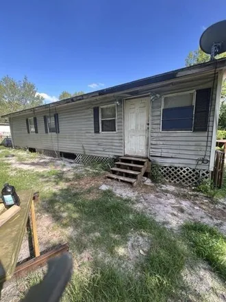 Buy this studio apartment on 16480 Northeast 49th Terrace in Marion County, FL 32113