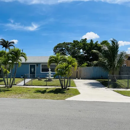Buy this 4 bed house on 858 Scott Drive in Palm Beach County, FL 33415