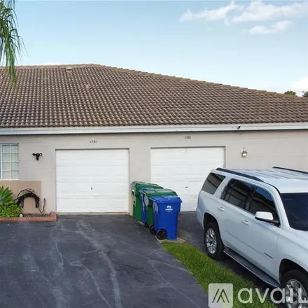 Rent this 2 bed townhouse on 1751 SW 116th Way