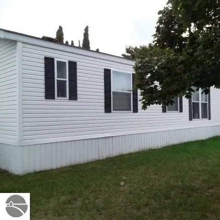 Buy this studio apartment on 2480 Countrywood Court in Garfield Charter Township, MI 49686
