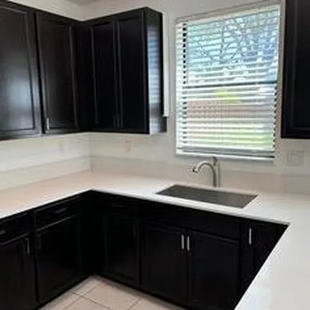 Rent this 3 bed apartment on 12789 Anthorne Lane in Delray Gardens, Palm Beach County