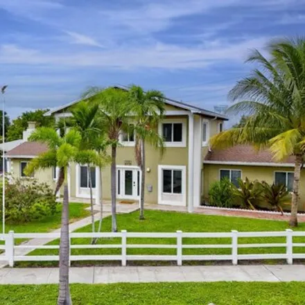 Rent this 4 bed house on 199 Southeast 11th Street in Shorewood, Deerfield Beach