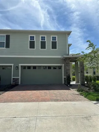Rent this 3 bed townhouse on Pleasant Cypress Circle in Kissimmee, FL 34741
