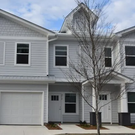 Rent this 3 bed townhouse on Date Palm Lane in Freeport, Walton County