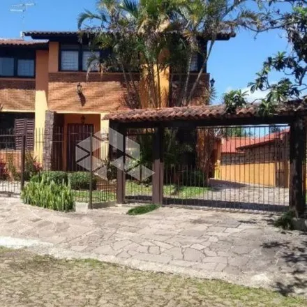 Buy this 5 bed house on Rua Oiampi in Guarujá, Porto Alegre - RS