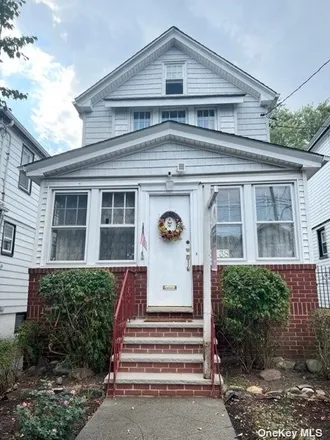 Buy this 3 bed house on 91-38 90th Street in New York, NY 11421
