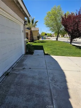 Rent this 4 bed house on 4206 Vahan Court in Lancaster, CA 93536