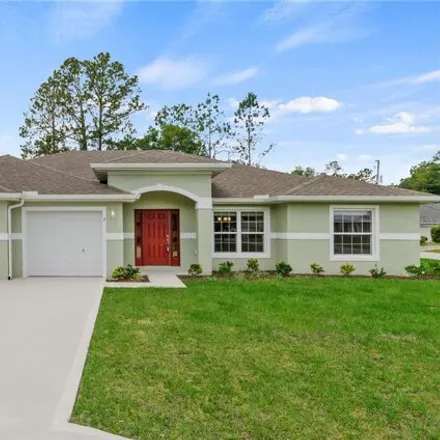 Buy this 4 bed house on 54 Zephyr Lily Trail in Palm Coast, FL 32164