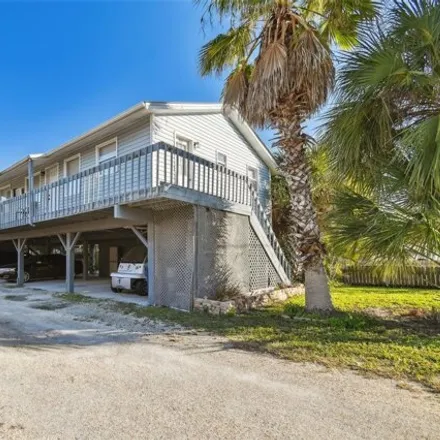 Buy this 4 bed house on El Palmar Cottages. LLC in Gulf Boulevard, Indian Rocks Beach