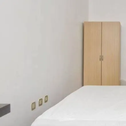 Rent this 7 bed room on Rua Passos Manuel