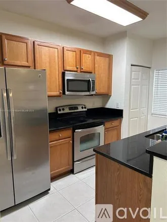 Rent this 2 bed townhouse on 12284 SW 27th St