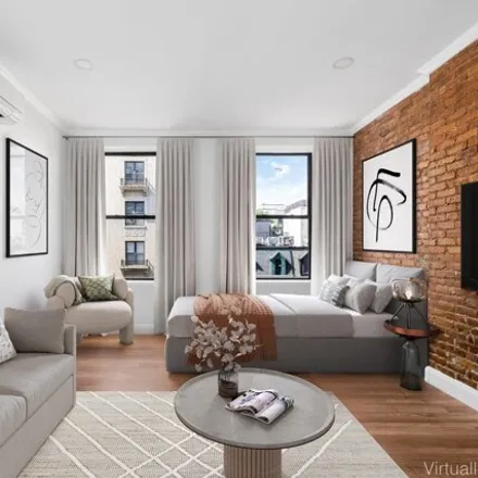 Rent this studio townhouse on 125 West 123rd Street in New York, NY 10027