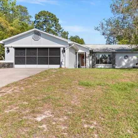 Buy this 2 bed house on 13135 Groveland Street in Spring Hill, FL 34609