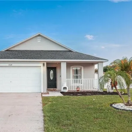 Rent this 4 bed house on 2428 Black Powder Ln in Kissimmee, Florida