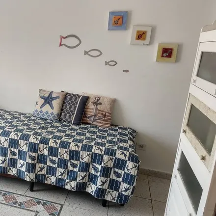 Rent this 4 bed condo on Guarujá in Região Metropolitana da Baixada Santista, Brazil