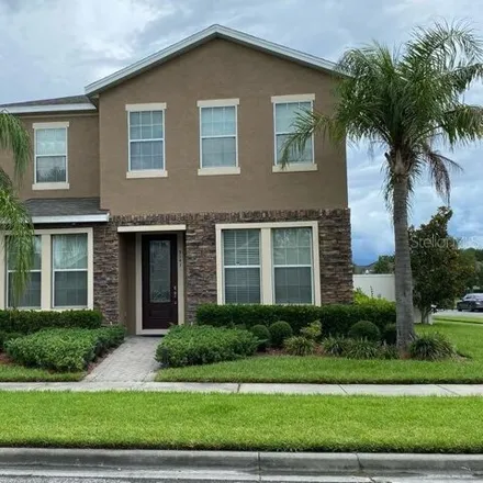 Rent this 4 bed house on 5141 Creekside Park Ave in Orlando, Florida