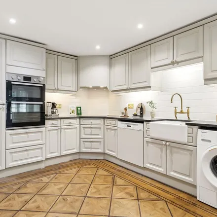 Rent this 4 bed townhouse on 6 Paultons Square in Lot's Village, London