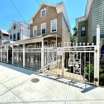 Buy this 3 bed townhouse on 232 Sunnyside Avenue in New York, NY 11207