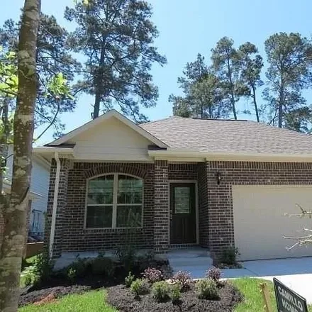 Rent this 3 bed house on 11235 Burning Tree Drive in Montgomery County, TX 77356