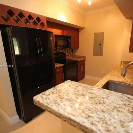 Rent this 2 bed condo on 231 SW 116th Ave