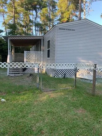 Rent this 3 bed house on 601 Magnolia Park in Onalaska, Polk County