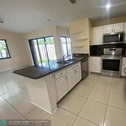Rent this 3 bed house on The Pines West in Broward County, FL 33309