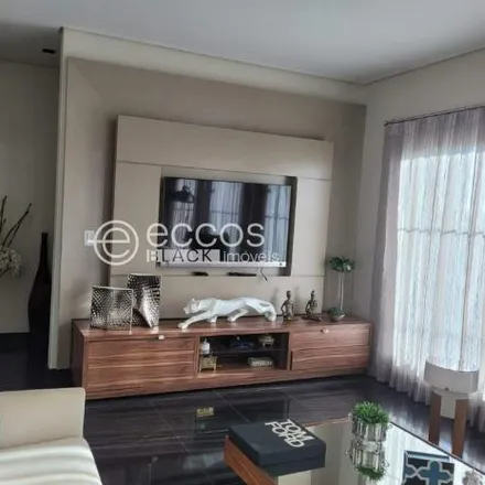 Buy this 4 bed house on Alameda José Aires Gomes in Jardim Inconfidência, Região Geográfica Intermediária de Uberlândia - MG