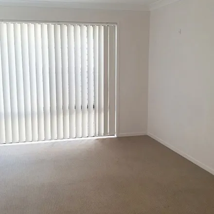 Rent this 4 bed apartment on 29 Philong Street in Doolandella QLD 4077, Australia