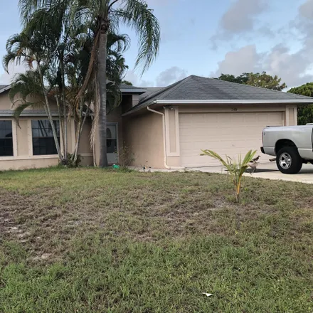 Buy this 3 bed house on 247 Southwest Moselle Avenue in Port Saint Lucie, FL 34984