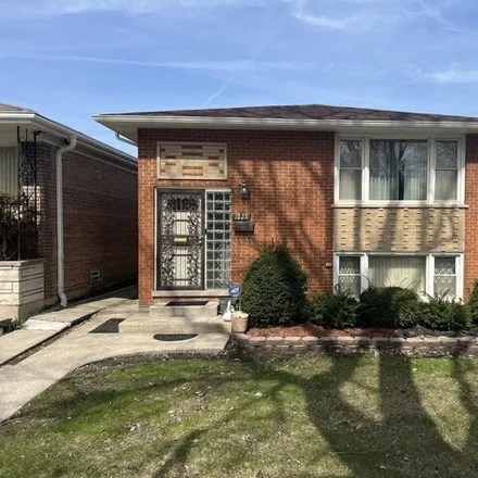 Buy this 3 bed house on 1228 East 87th Place in Chicago, IL 60619